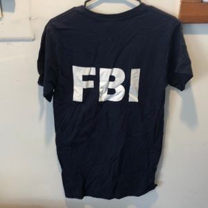 Blue t shit says fbi on back